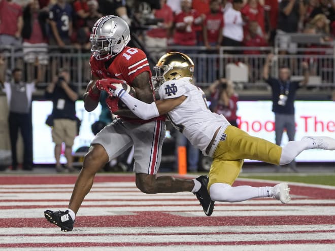 Ohio State wide receiver Xavier Johnson, left, gives the Buckeyes a 14-10 lead over Notre Dame on a 24-yard touchdown catch with Notre Dame's Jaden Mickey in coverage.