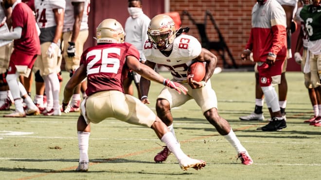 WR Jordan Young looks to elude CB Asante Samuel Jr. during practice this preseason.