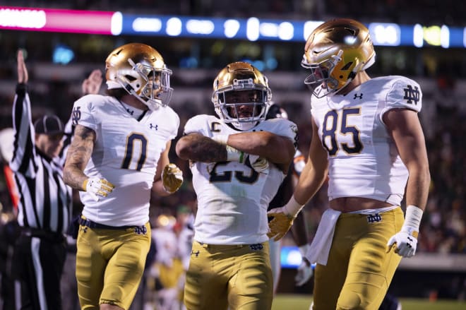 Notre Dame's Kyren Williams (23) followed a year as an afterthought with a 1,000-yard rushing season catalyzed by a transformative summer during the COVID-19 pandemic. 