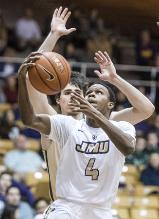 James Madison junior guard Joey McLean drives for a shot in the Dukes' win over William & Mary on Thursday.