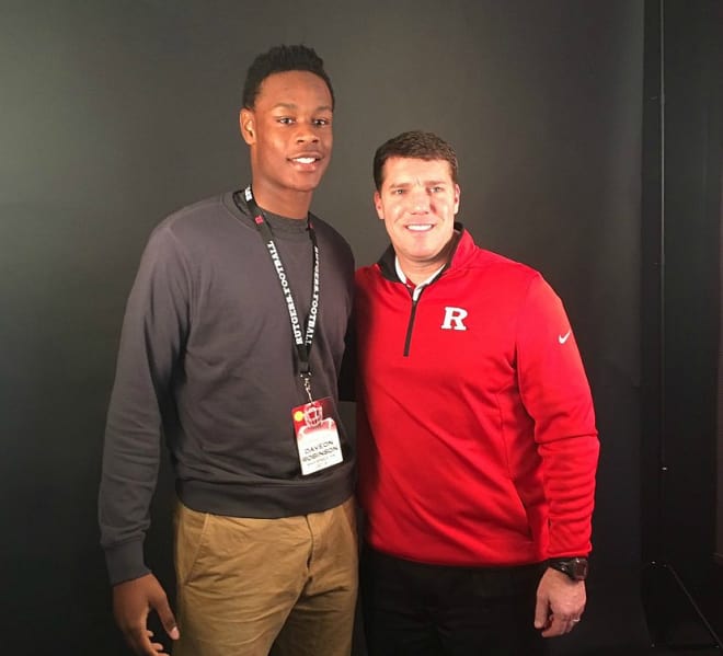 Robinson poses with Chris Ash during a winter visit to RU