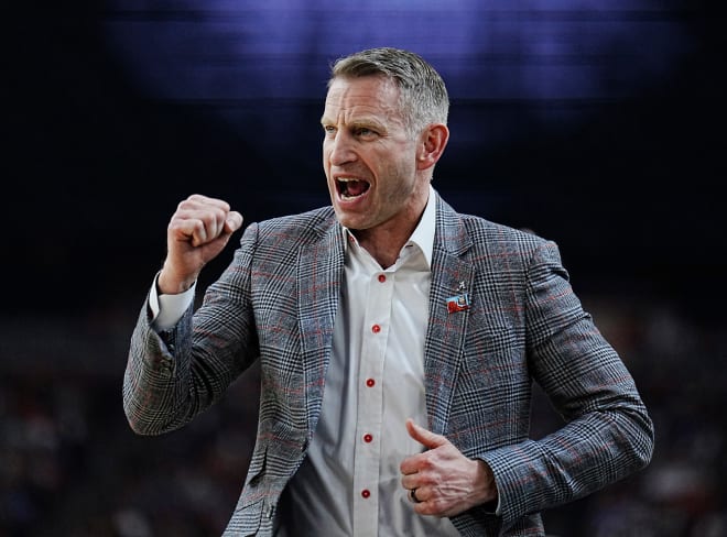 Alabama head coach Nate Oats celebrates a play against Connecticut during the Final Four semifinal game at State Farm Stadium.