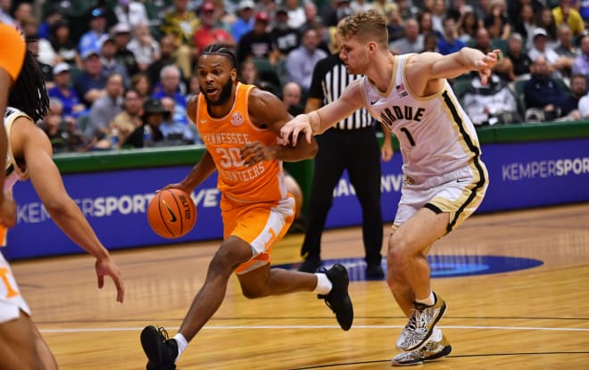 Nov 21, 2023; Honolulu, HI, USA; Tennessee Volunteers guard Josiah-Jordan James (30) drives the ball downcourt past Purdue Boilermakers forward Caleb Furst (1) during the first period at SimpliFi Arena at Stan Sheriff Center. 