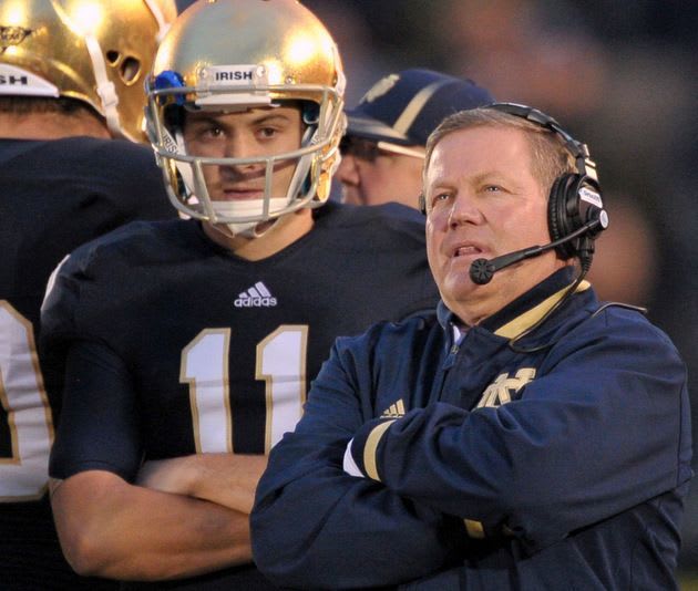 Brian Kelly and Tommy Rees (11), now the Irish quarterbacks coach, have thrived mostly in QB contingency plans.