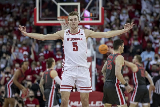 Wisconsin's Tyler Wahl (5) signals after hitting one of the Badgers' 10 3-pointers.