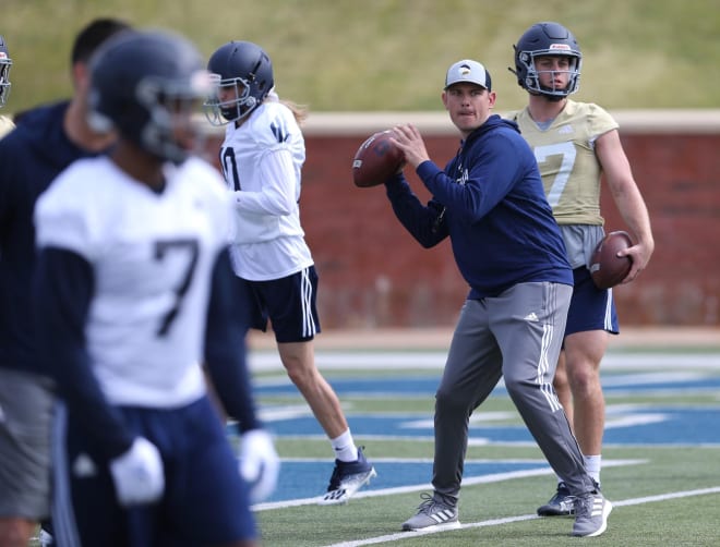 Georgia Southern offensive coordinator/ quarterbacks coach Bryan Ellis looks to throw the ball as he works with the quarterbacks and receivers during practice. Photo |  Richard Burkhart/Savannah Morning News / USA TODAY NETWORK