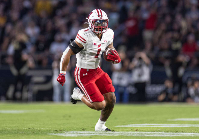 Wisconsin tailback Chez Mellusi will be back for a sixth season at Wisconsin. 