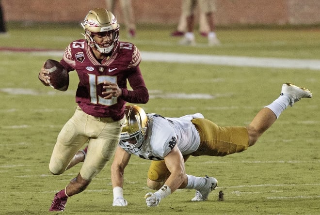 Jordan Travis led FSU to 28 points and nearly 350 yards of offense before leaving Sunday's game in the fourth quarter.