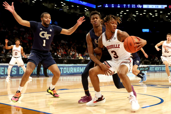 Tech swarm Noah Locke during the first half of the ACC Tournament game in Brooklyn