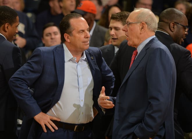 Head coach Mike Brey (left) and the Irish take on No. 12 Virginia on Tuesday.