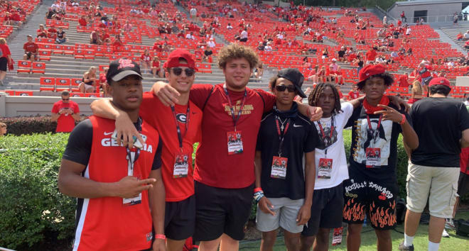 Madden Sanker (third from left) takes in a game in Athens on Sept. 11, 2021. Photo via Sanker's Twitter.