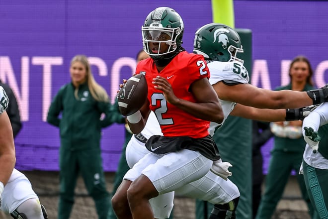 Quarterback Aiden Chiles scans the field during the spring showcase football scrimmage at Spartan Stadium, on April 20, 2024. (Marvin Hall/Spartans Illustrated)