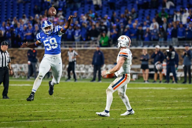 Duke's Michael Reese, left, deflects Virginia quarterback Brennan Armstrong's throw during last weekend's game. 