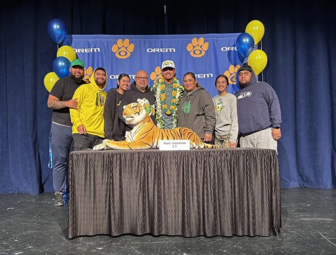 Four-star TE Roger Saleapaga signs his National Letter of Intent with Oregon on Wednesday.