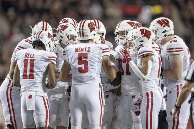 Graham Mertz calls a play in the huddle Saturday night against Ohio State. 