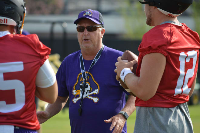 ECU offensive coordinator Donnie Kirkpatrick works with his quarterbacks in Friday's first full practice.