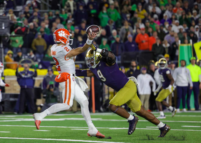 Pressure provided by Notre Dame defensive end Justin Ademilola (9) led to Clemson quarterback Cade Klubnik throwing an interception.