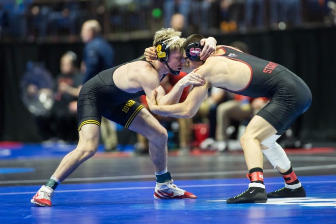 Iowa's Max Murin and Stanford's Jaden Abas lock up in their match at the NCAA Tournament. 