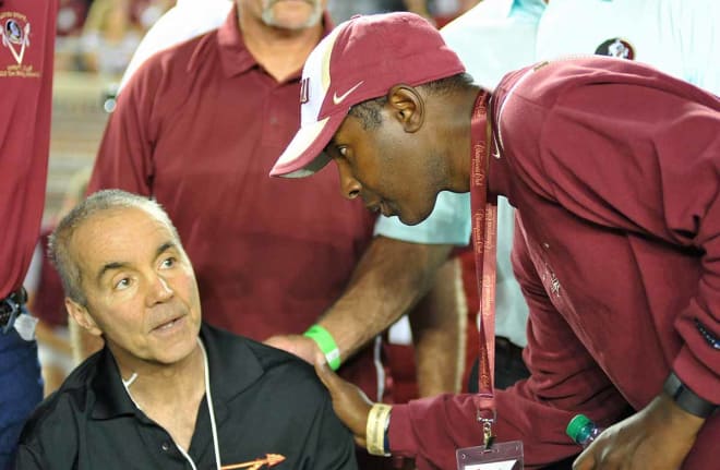 FSU Hall of Fame member Monk Bonasorte. left, was honored on Saturday. FSU great Charlie Ward shares a moment before the game.
