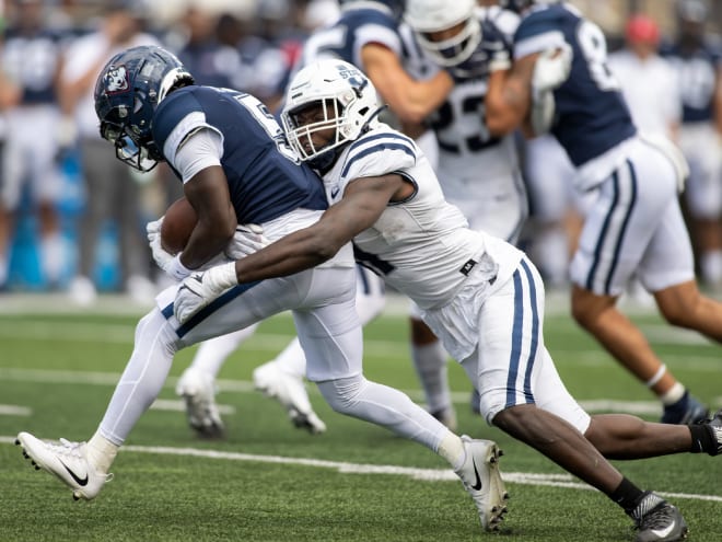 Defensive end Byron Vaughns, right, made 99 tackles in the past two seasons at Utah State.