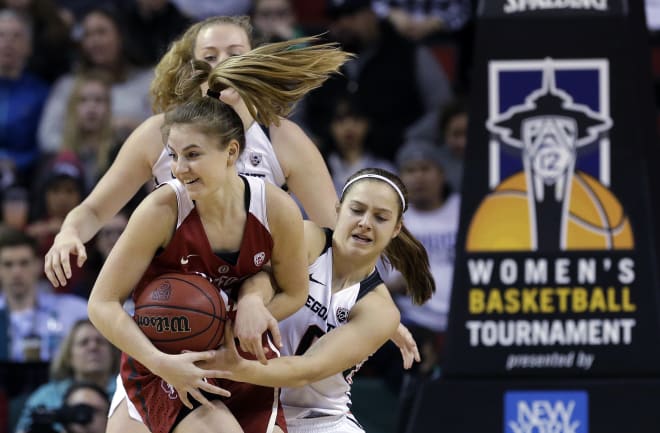 Stanford's Karlie Samuelson, left, and Oregon State's Mikayla Pivec fight for possession of the ball in the first half of the Pac-12 Conference championship NCAA college basketball game, Sunday, March 5, 2017, in Seattle. 