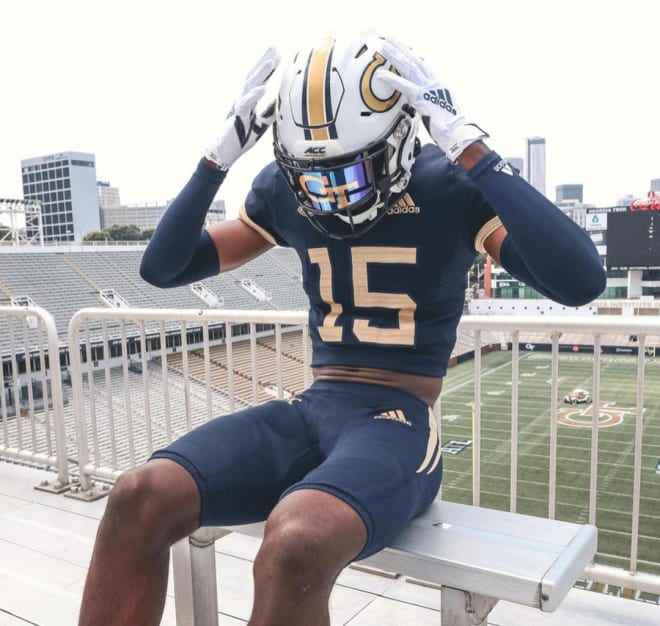 Allen poses in a GT uniform outside coach Collins office in Bobby Dodd Stadium