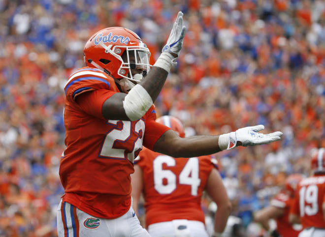 Sep 30, 2017; Gainesville, FL, USA; Florida Gators running back Lamical Perine (22) does the gator chomp as he ran the ball in for a touchdown against the Vanderbilt Commodores during the first half at Ben Hill Griffin Stadium. Mandatory Credit: Kim Klement-USA TODAY Sports