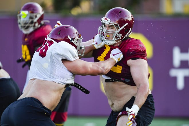 Andrew Vorhees (right), who will be competing for a starting offensive guard spot, takes on Caleb Tremblay on Monday.