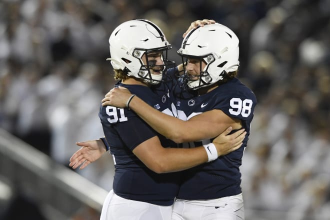 Penn State place kicker Jordan Stout (98) celebrates with Chris Stoll (91) after kicking a 50-yard field goal in the fourth quarter of the Indiana game. AP photo