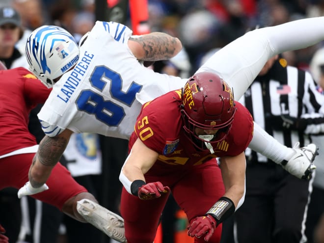 The Cyclones' top graded defensive player Caleb Bacon chops down Memphis' Anthony Landphere during the Liberty Bowl.