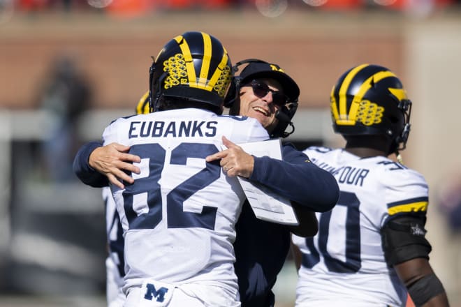 Redshirt junior tight end Nick Eubanks, Jim Harbaugh and the Michigan Wolverines escaped from Illinois with a 42-25 win.