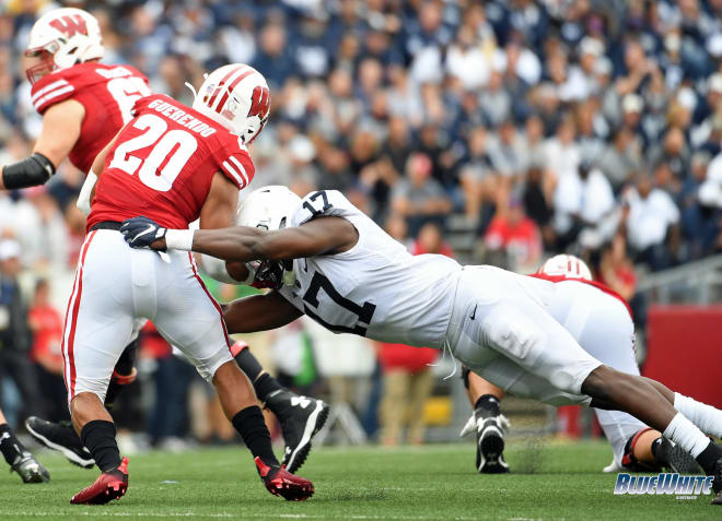 Penn State defensive end Arnold Ebiketie tackles Wisconsin running back Chez Mellusi. BWI photo/Steve Manuel