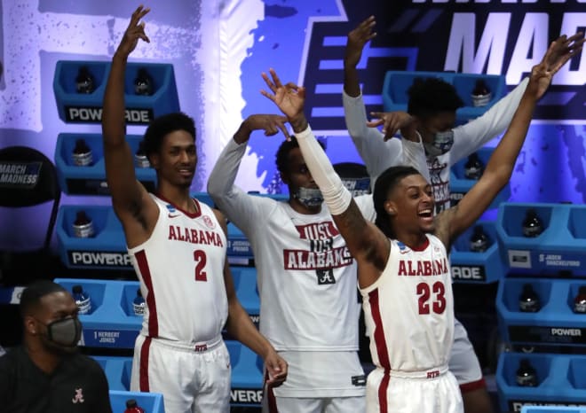 Alabama Crimson Tide guard John Petty Jr. (23) and Alabama Crimson Tide forward Jordan Bruner (2) celebrate a three-pointer during the first round of the 2021 NCAA Tournament on Saturday, March 20, 2021, at Hinkle Fieldhouse in Indianapolis, Ind. Photo | Imagn