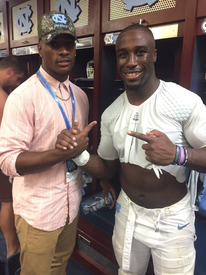 Demetrius Mauney shares a moment with UNC RB Elijah Hood after the big win over Pitt