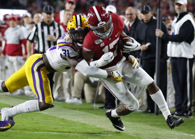Jaylen Waddle (17) of the Alabama Crimson Tide is tackled by Cameron Lewis (31) of the LSU Tigers during the second half at Bryant-Denny Stadium last season. Photo | Getty Images