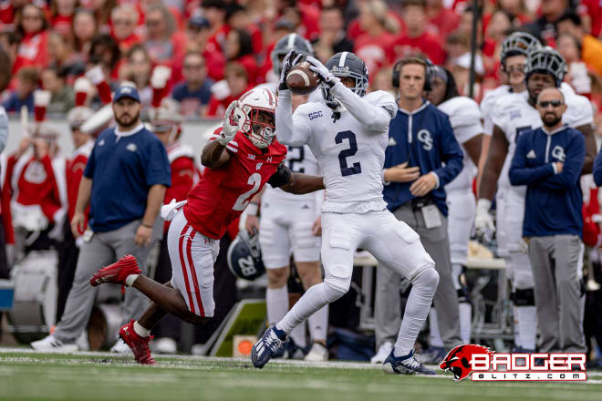 Georgia Southern wide out Derwin Burgess Jr. reels in a pass with Ricardo Hallman in coverage. 