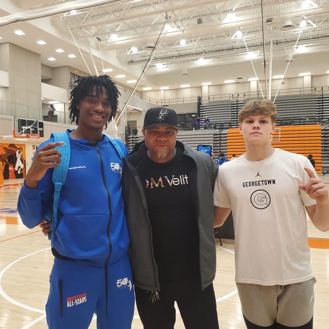 Pals Malik Bowan (l.) and Rowan Brumbaugh (r.), flank their former coach, Marcus Chester. 