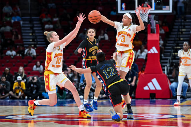 Future Notre Dame players Emma Risch (10) and Hannah Hidalgo (3) swarm after a loose ball during Tuesday night's McDonald's All American Girls Game.