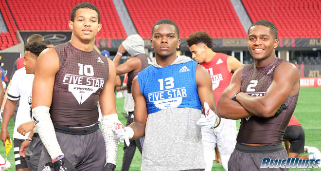 Rudolph (center), joined LB Brandon Smith (right) and RB Devyn Ford at the Rivals100 Five-Star Challenge in June.