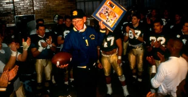 Former Notre Dame football head coach Lou Holtz in the locker room with his team after a game