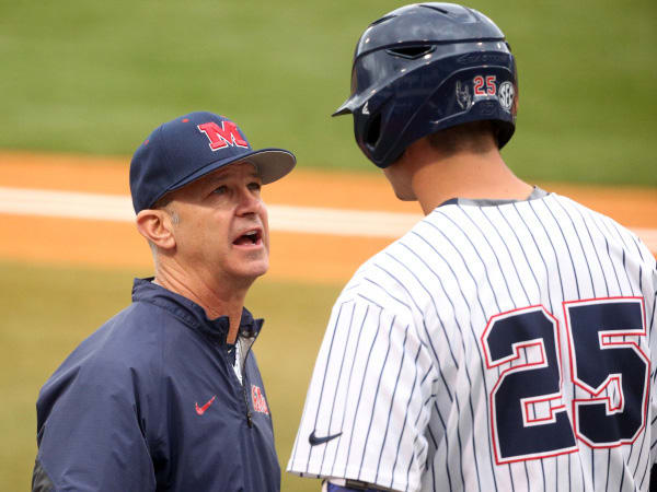 Colby Bortles (right) speaks with head coach Mike Bianco