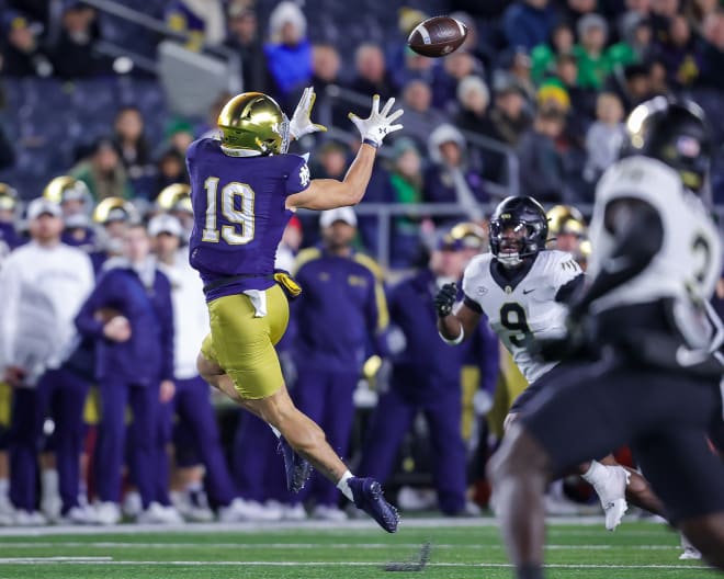 Freshman Jaden Greathouse hauls in one of this three pass receptions Saturday against Wake Forest.