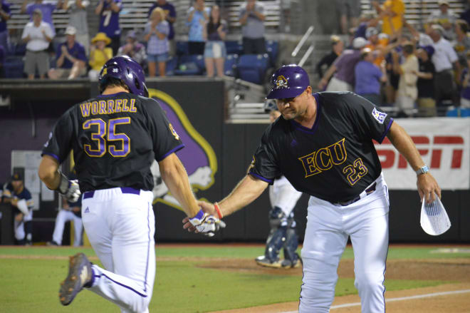 Bryson Worrell is congratulated by head coach Cliff Godwin after his home run in ECU's win over Quinnipiac.