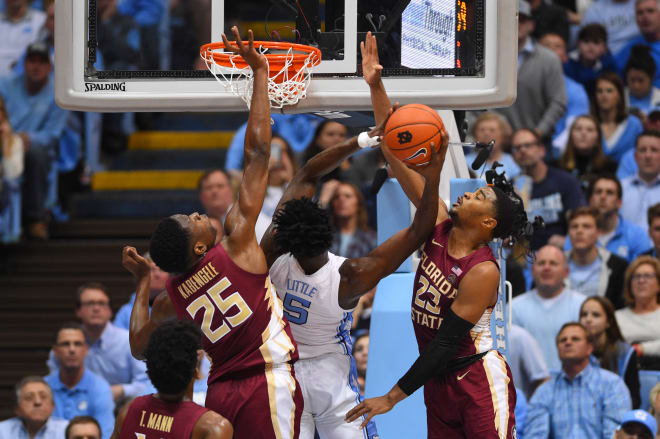 Florida State's Mfiondu Kabengele and M.J. Walker try to block Nasir Little's shot attempt on Saturday in Chapel Hill.