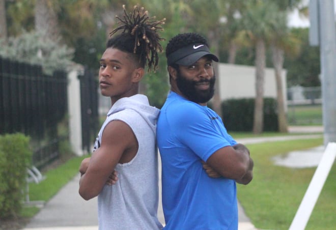 Top 2022 DB Earl Little Jr. and his father, Earl Little Sr., pose for a photo. 
