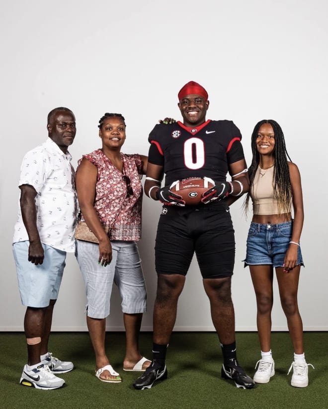 No. 1 defensive tackle Justin Scott with his family on his Georgia official visit. Photo via Scott's Instagram.