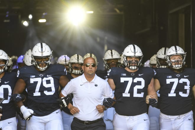 Penn State coach James Franklin and members of his offensive line lead the Nittany Lions onto the field before a win over Villanova. AP photo