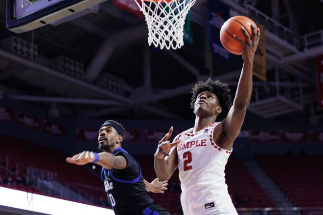 Jahlil White, who had a career-high nine assists Saturday, scores two of his nine points on a layup. 