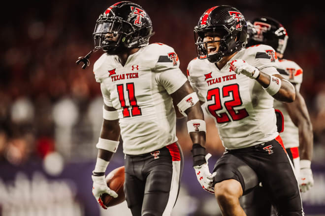 Reggie Pearson Jr. and Eric Monroe celebrate a turnover for the Red Raider defense.