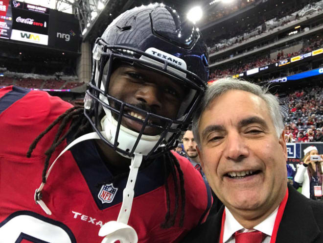 South Carolina President Harris Pastides takes a selfie with Jadeveon Clowney.